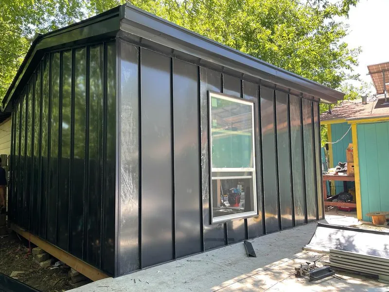 Black standing seam metal wall panels for Metal Roof Installation in Ayer