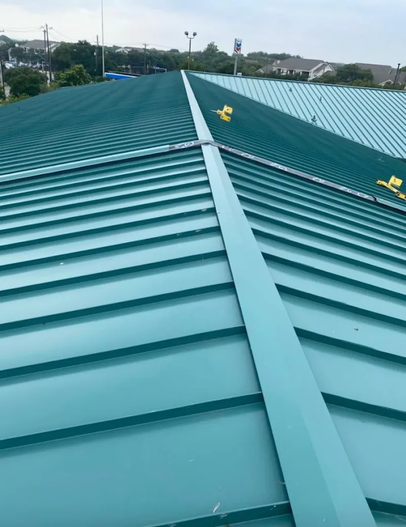 Green commercial metal roof ridge and valley for Metal Roof Repair in Ayer